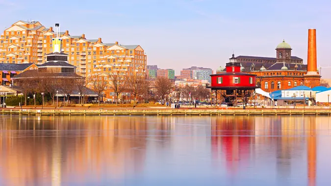 Colorful reflections of waterfront buildings at Inner Harbor in Baltimore, Maryland.
