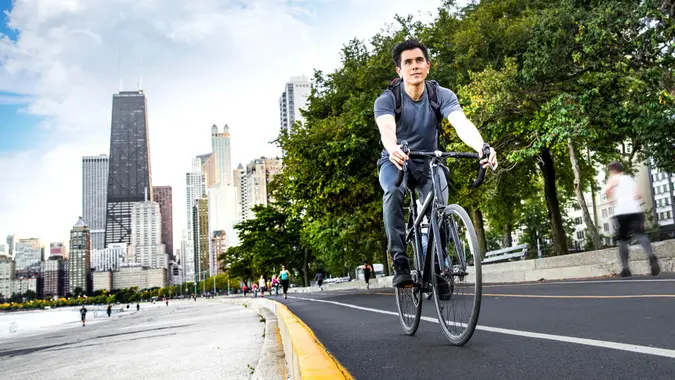 Young man cycling in the city, commuting to work in Chicago - USA.