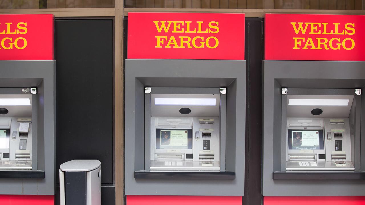 San Francisco, California, USA - April 24, 2011:  Three Wells Fargo ATM machines located side by side at a bank branch in the downtown San Francisco Financial District.