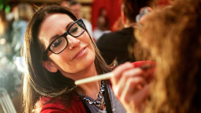Makeup artist Bobbi Brown applying makeup on a model