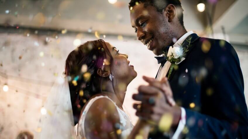 Newlywed couple dancing wedding celebration.