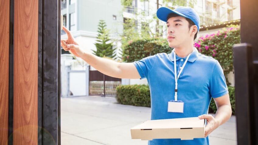 Delivery person ringing doorbell
