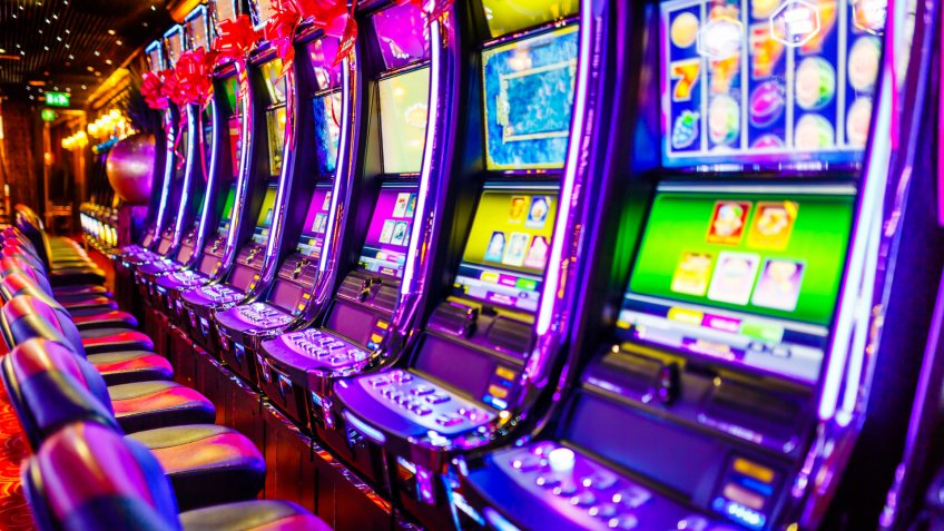 Stock, shares, NASDAQ, S&P 500, money, Line of electronic slot machines in casino.