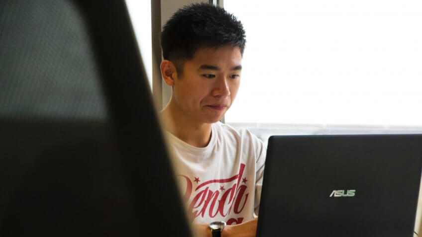 Young man working on a laptop