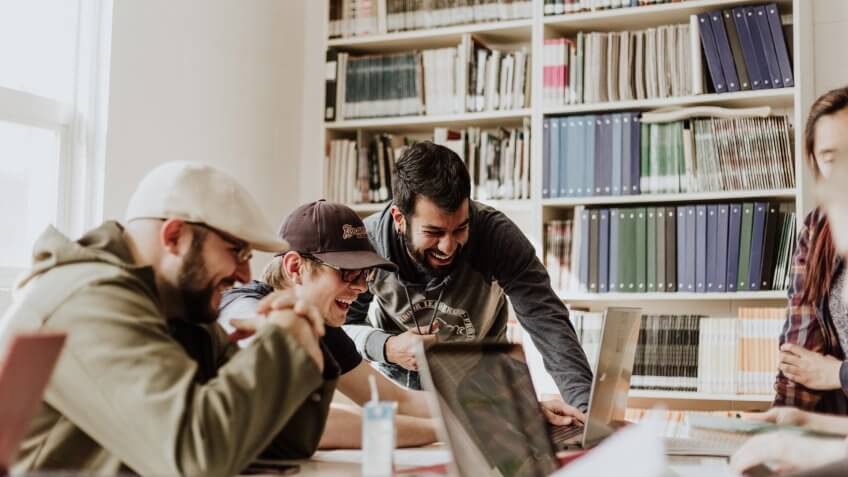 Group of young males laughing on a collaboration