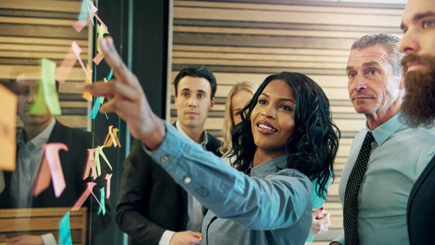 businesswoman communicating with her colleagues