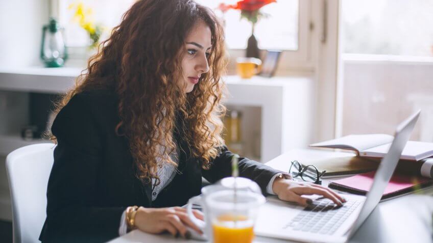 Stylish woman working in her modern office