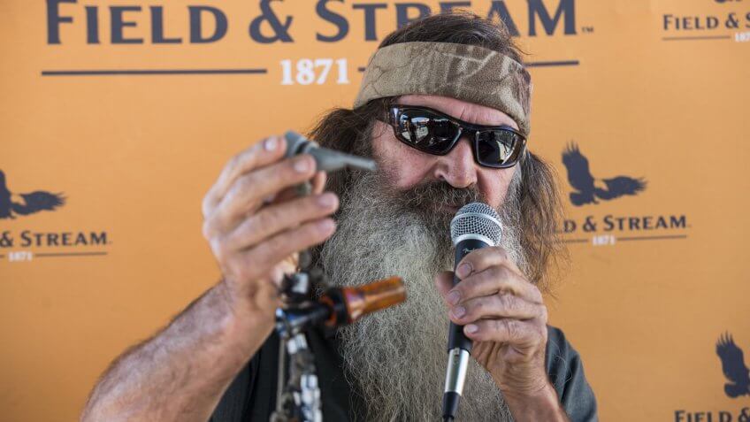 Phil Robertson, reality television star from the Duck Dynasty series, demonstrates a duck call during a recent store appearance at the new DICK'S Sporting Goods Grand Opening Celebration at the Baybrook Mall in Friendswood, TX onDICK'S Sporting Goods Houston Grand Opening Celebration, Friendswood, USA.