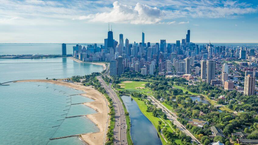 Chicago Skyline aerial view with road by the beach.