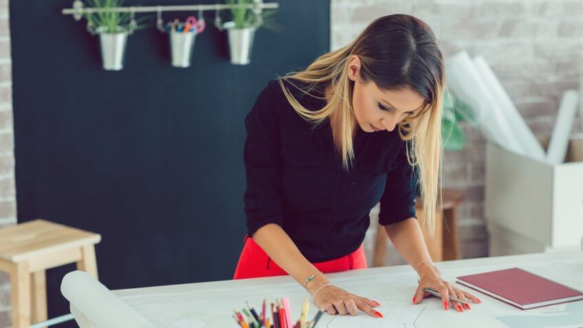 Female architect working in her new modern office.