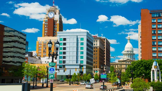 Lansing downtown skyline (with the Boji Tower on the right) with the Michigan State Capitol building in the back.