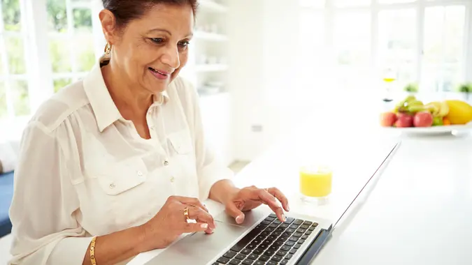 Senior woman using laptop
