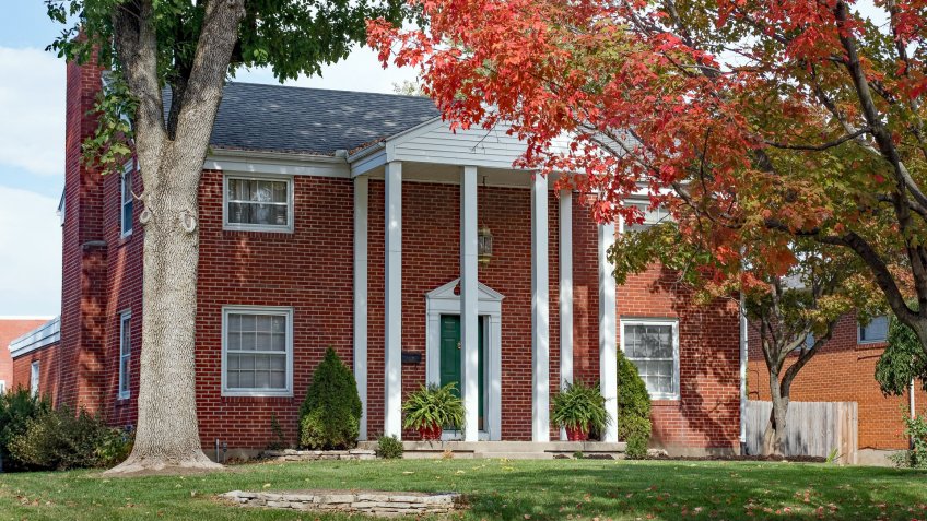 Red Brick Home with Tall Pillars