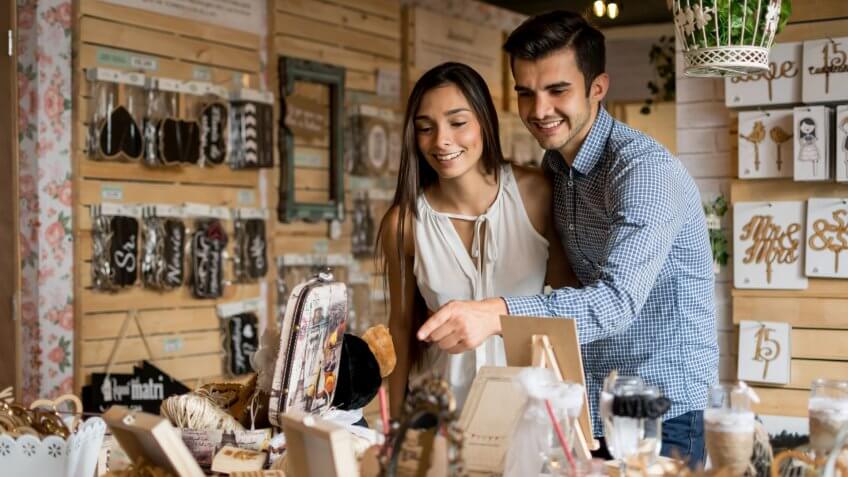Young couple looking to buy wedding favors