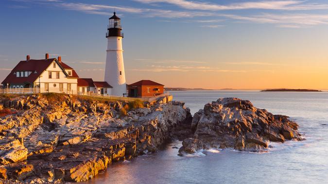 The Portland Head Lighthouse in Maine, USA at sunrise.