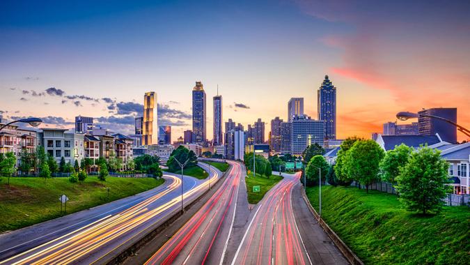 Atlanta, Georgia, USA downtown city skyline over Freedom Parkway.
