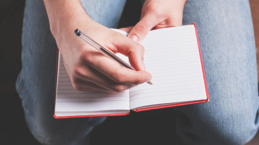 woman taking notes