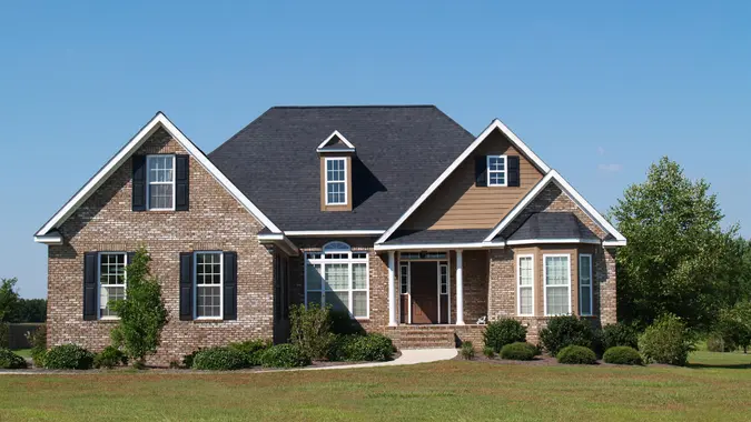 Small two story brick home with porch