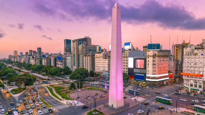 Plaza de la Republica in the centre of Buenos Aires with the Obelisco, one of the main symbols of the capital of Argentina at dawn with heavy traffic.