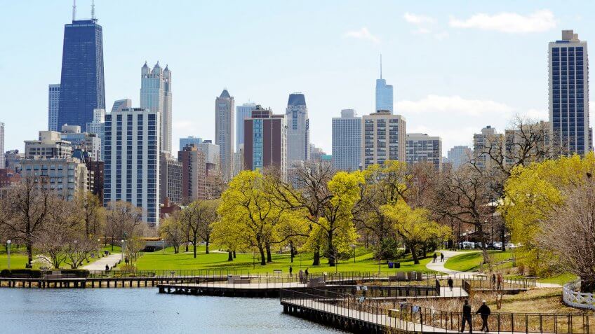 Chicago skyline with skyscrapers viewed from Lincoln Park over lake Illinois.