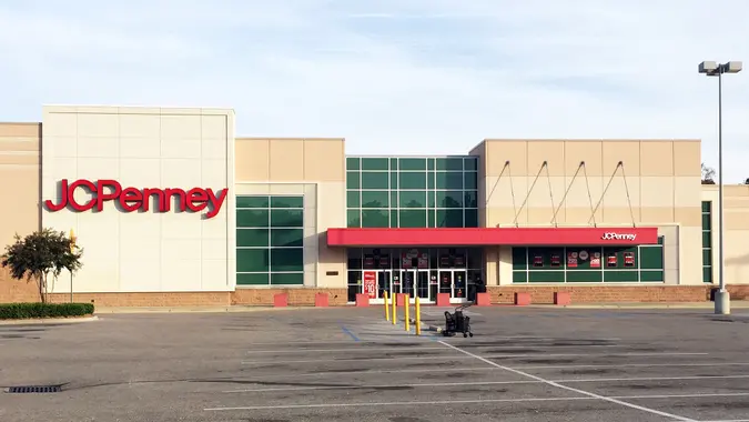 The exterior of a JCPenney store viewed from an empty parking lot.