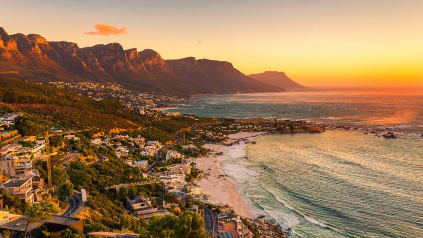 A wide picture of Clifton Beach in Cape Town, South Africa at late afternoon in a beautiful sunset.