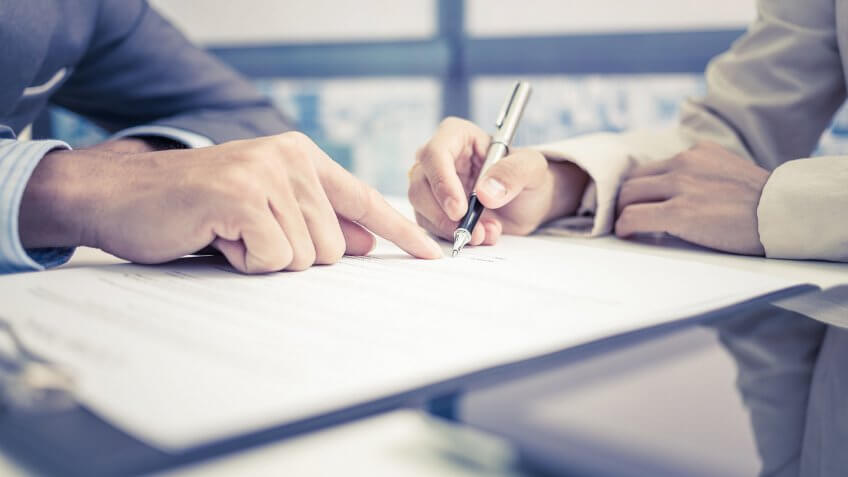 business people signing a contract