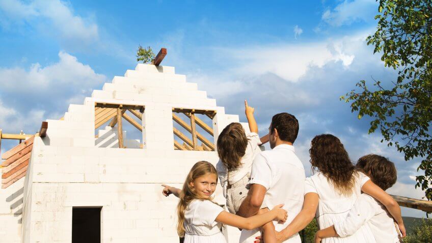 family with big house