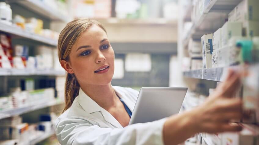 pharmacist using her digital tablet
