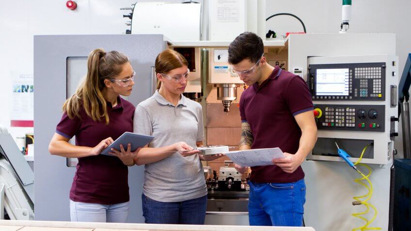 Group of young adults work with a tutor.