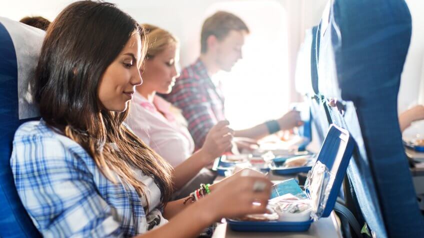 Group of people travelling by airplane.