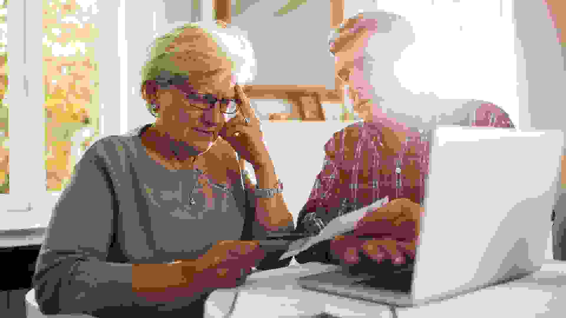 Senior couple paying their bills.