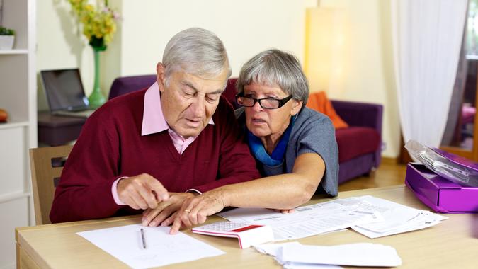 senior couple reviewing finances