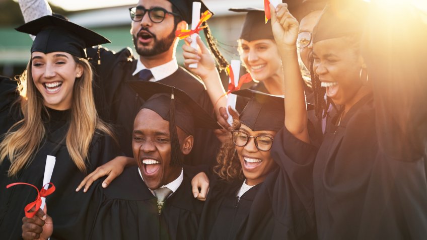 Shot of a group of cheerful university students on graduation day.