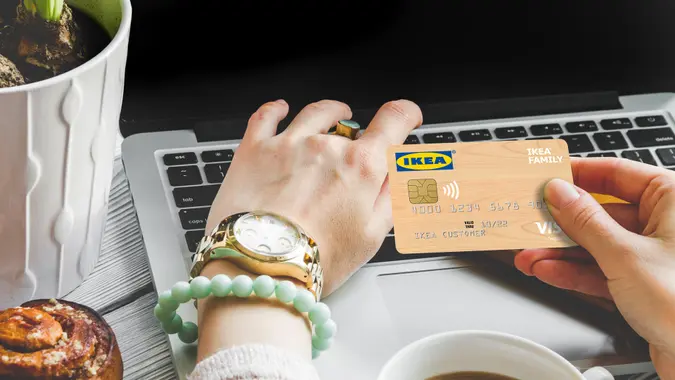 Woman paying with IKEA credi card