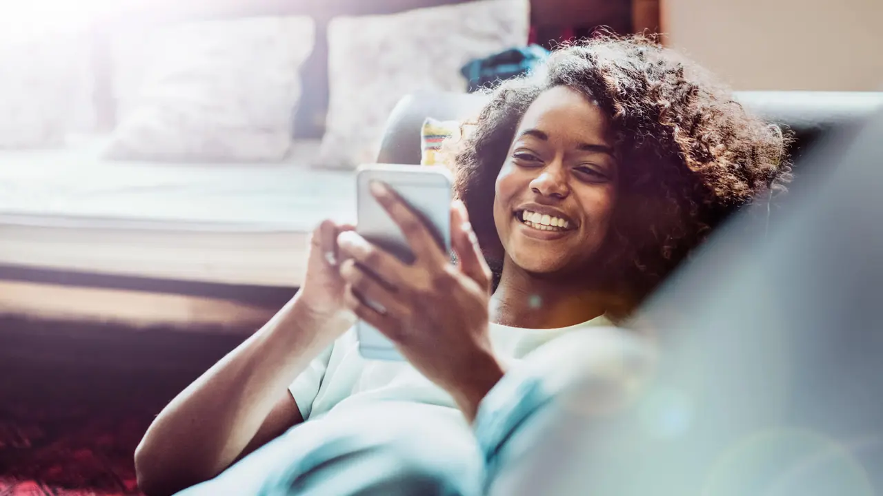 A photo of young woman using mobile phone.