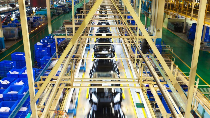 final assembly line of car factory, elevated view.