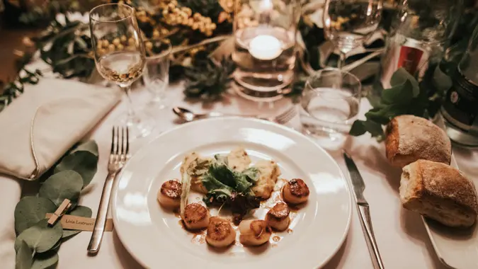 Upscale dinner lit by candlelight, expensive meal