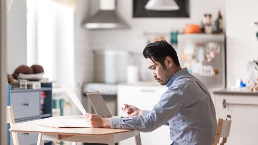 Japanese man in nordic style home.