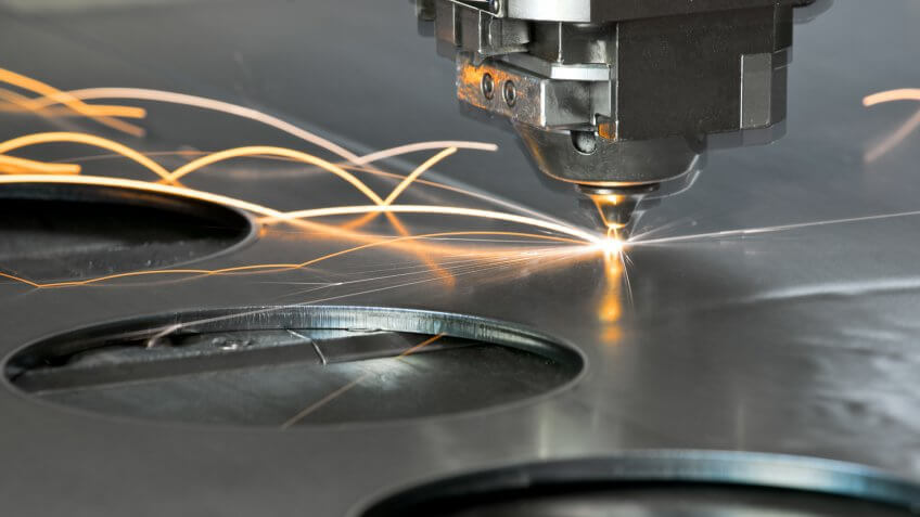 Laser metal cutting manufacturing tool in operation.