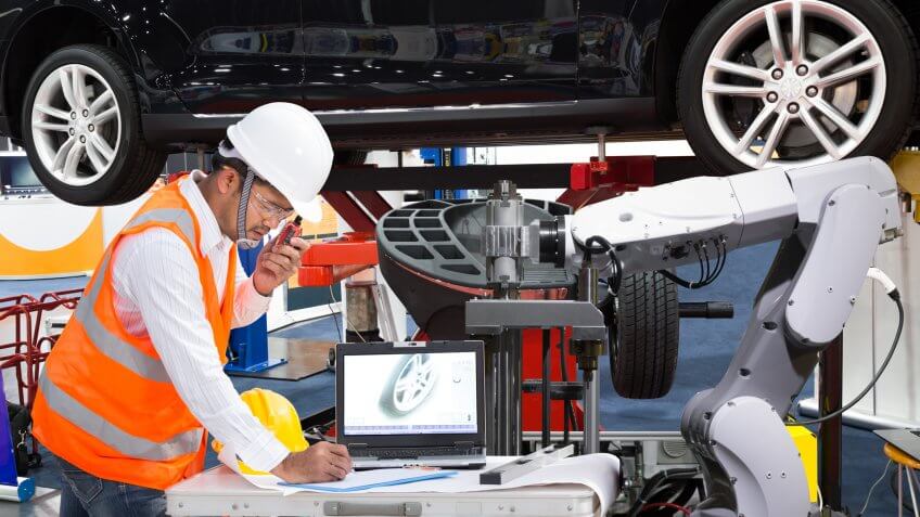 Automotive engineer with assistance robotic inspec modern car, Industry 4.