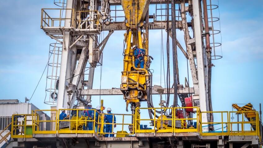 Crane being used to frack oil