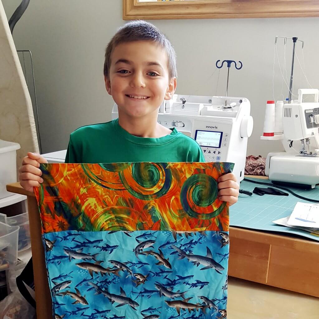 nine-year-old Gabriel Roberge with pillow case