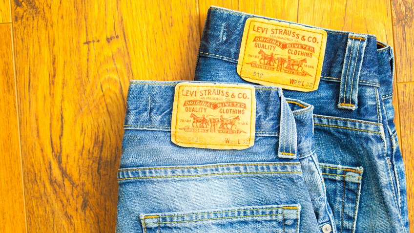 Moscow, Russia, February 06, 2015: close up of the Levis yellow label on the back pocket of a two pair of denim jeans.