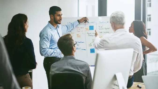 Shot of a group of business colleagues meeting in an office.