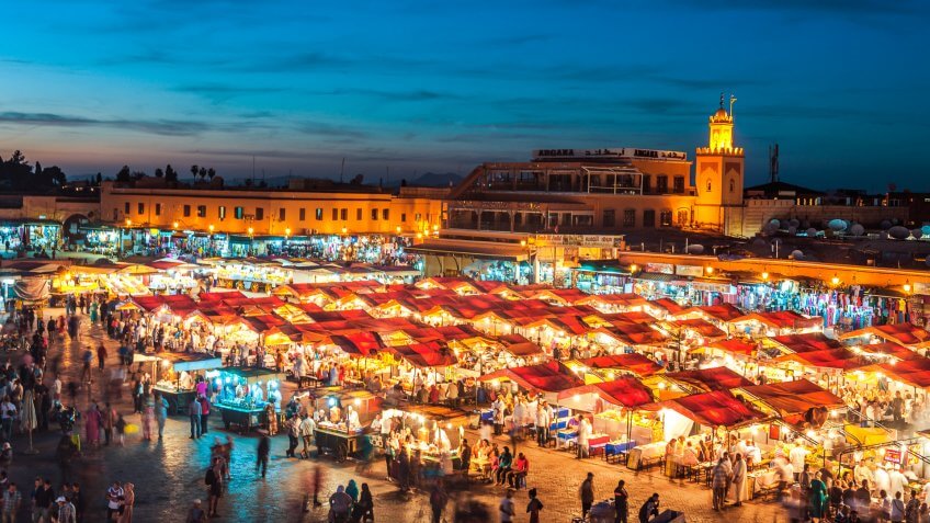 Famous Djemaa El Fna Square in early evening light, Marrakech, Morocco with the Koutoubia Mosque, Northern Africa.
