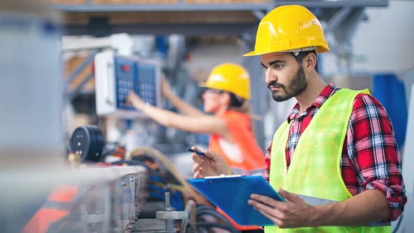 Portraits of workers in pvc factory.
