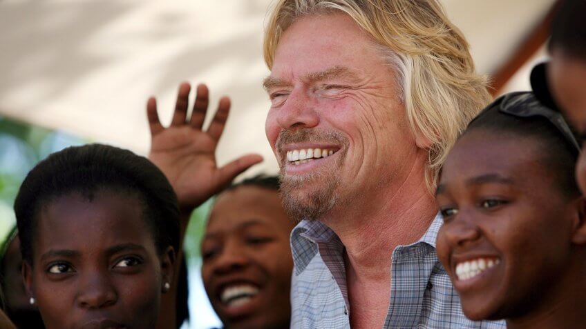 Mandatory Credit: Photo by Jon Hrusa/EPA/REX/Shutterstock (7867229b)British Billionaire Entrepeneur Sir Richard Branson Shares a Laugh with Students at the Cida City Campus in Johannesburg South Africa Wednesday 25 October 2006 Branson Attended the Launch of the 'Women On the Move' Programme at the Campus Which is Funded by Virgin Unite Branson's Independent Arm of the Virgin GroupSouth Africa Branson Charity - Oct 2006.
