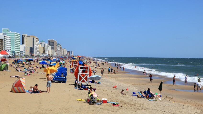 Virginia Beach City resort with tourist on the beach's enjoying a summer day.