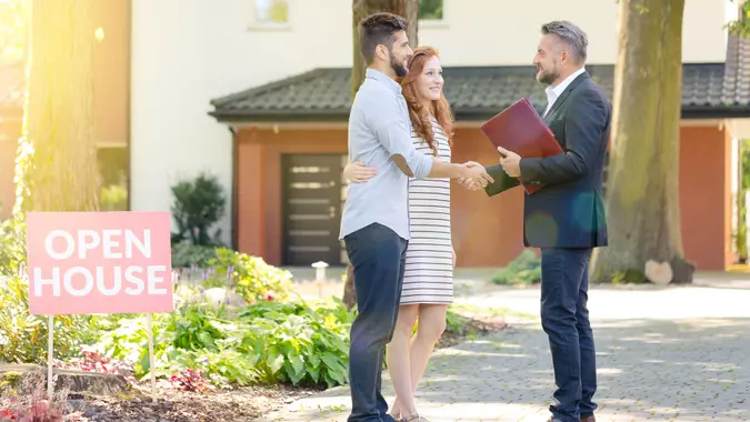 couple meeting with realtor